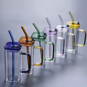 Vibrant colored glass mug featuring a sturdy handle, leakproof lid, and reusable straw. Perfect for iced coffee, juice, or water on the go.