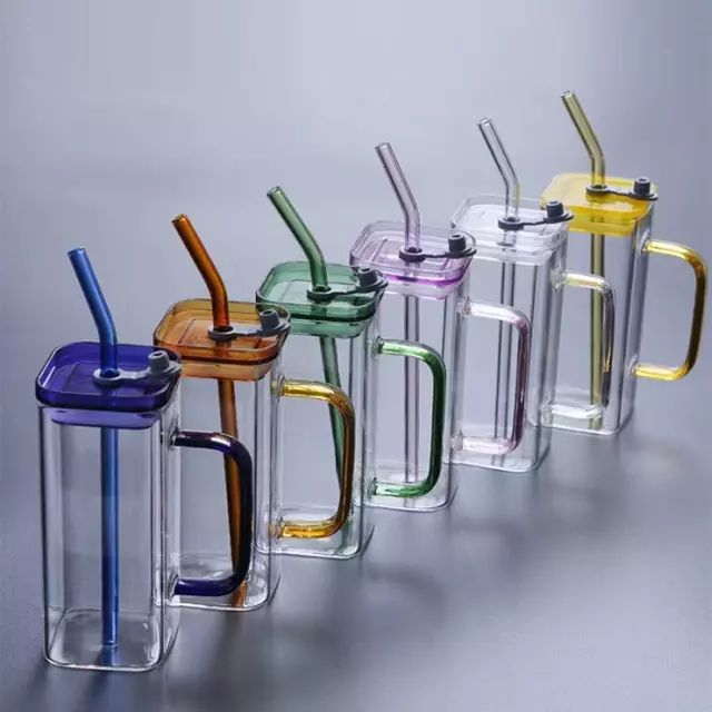 Vibrant colored glass mug featuring a sturdy handle, leakproof lid, and reusable straw. Perfect for iced coffee, juice, or water on the go.