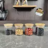 Jiateng’s space-saving glass canisters neatly stacked in kitchen cabinets, keeping cereals and beans fresh.