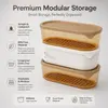 Top view of oval stackable food storage box with beige fitted lid and dimensions of 22.4cm by 11.2cm
