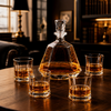 Geometric whiskey decanter gift set with four coordinated drinking glasses