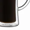 Tall transparent double wall coffee cup with gently curved sides and a tapered inner drinking chamber