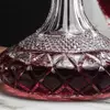 elegant red wine serving set featuring decorative decanter and four stemmed drinking glasses