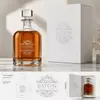 Round glass whiskey decanter with ribbed lower body for modern home bar display