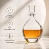Modern whiskey decanter with clear decorative stopper and smooth rounded shoulders