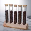 Stylish glass coffee bean organizer with airtight bamboo lids for fresh bean storage