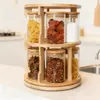 Clear glass kitchen storage containers with bamboo lids for spices, tea, coffee, and dry foods