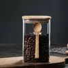 Stylish bamboo lid coffee bean jar with matching wooden spoon for daily coffee preparation
