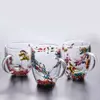 Jiateng double-wall insulated glass cups with real dried flowers inside, perfect for serving milk tea or herbal tea.