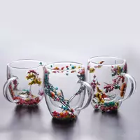 Jiateng double-wall insulated glass cups with real dried flowers inside, perfect for serving milk tea or herbal tea.