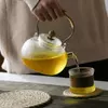 Handmade transparent teapot with vintage rope wrapped handle by Jiateng