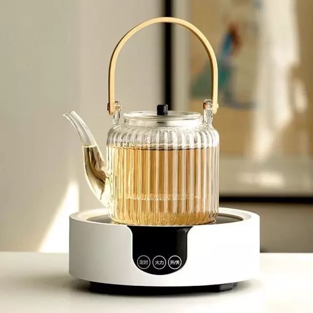 Clear heat resistant glass teapot with elegant wooden handle for loose leaf tea