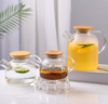 Jiateng clear glass tea pitcher with bamboo lid, perfect for serving tea, infused water, or juice, stylish and eco-friendly