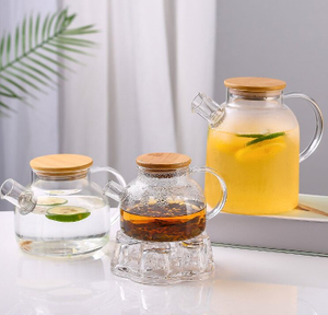 Jiateng clear glass tea pitcher with bamboo lid, perfect for serving tea, infused water, or juice, stylish and eco-friendly