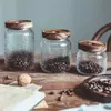 Modern Jiateng textured glass storage jars with wooden tops for herbs snacks tea and spices