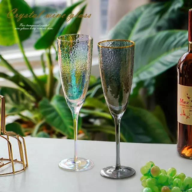 Elegant colorful crystal wine glasses with hammered texture for luxury dining
