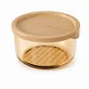 Round single layer glass food storage containers in 300ml 450ml and 650ml capacities with transparent amber glass bodies and beige PP lids