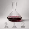 Tall neck wine decanter with broad rounded base and elegant transparent design
