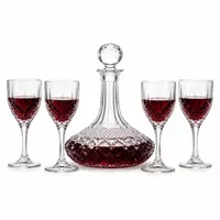 decorative red wine decanter set with four stemmed wine glasses for elegant wine serving