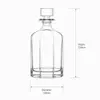 Clear fluted whiskey decanter with decorative geometric glass stopper