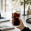 Tall clear stackable glass cup with lid straw ice and iced coffee