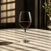 Long stem red wine glass with simple transparent design for table service