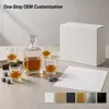 Modern whiskey serving set with square decanter and four drinking glasses