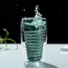 Close-up of spiral pattern and double wall design of glass cup