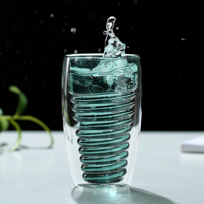 Close-up of spiral pattern and double wall design of glass cup