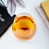 Handcrafted glass cup with starfish inside, ocean-themed design for tea or juice