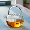 Designer heat resistant glass tea pot with modern colorful handle and elegant pouring spout