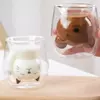 clear insulated glass mug featuring adorable cat face design filled with milk