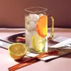 Aesthetic pastel glass water bottle with a functional handle and leakproof top. Crystal clear body showcases your favorite drinks.