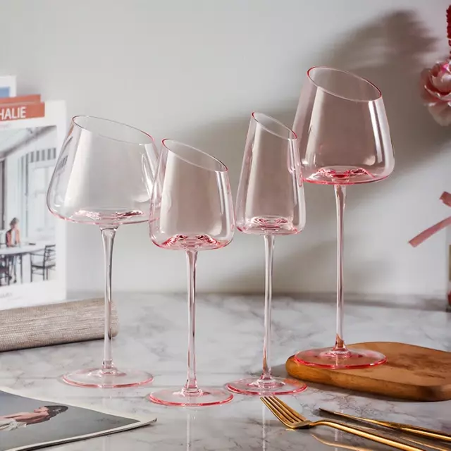 Modern pink crystal wine glass goblet on marble table for home dining and wedding decoration