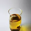 Close-up of the artistic wave design and clear finish of a sculptural drinking glass