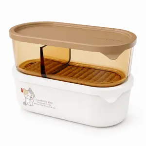 1060ml oval divided food storage container with beige lid transparent amber compartment white base and removable inner drain tray