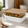 Stackable PP and AS food storage containers with white bases, amber transparent sections and beige lids for wholesale kitchenware buyers.