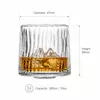 Clear ribbed whiskey glass with vertical textured walls for spirits serving