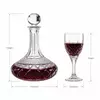 patterned glass wine decanter with faceted stopper and four matching-style wine glasses