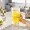 Ribbed stackable style glass cup with transparent lid and reusable straw