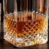 Rectangular whiskey decanter featuring a decorative glass stopper and patterned base
