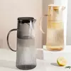 Elegant ribbed glass beverage jug for juice, lemonade, iced tea, and fruit-infused drinks