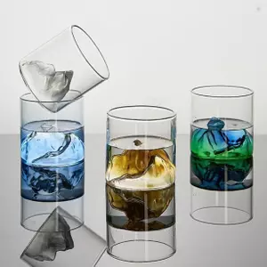 Jiateng creative color ice cubes whiskey glass with blue liquid and clear ice, perfect for cocktails, home bar, or as a decorative statement piece.