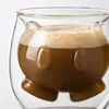 Clear borosilicate coffee cup featuring a cute face inspired inner glass design and rounded outer wall