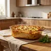 Top view of a 2.4L square amber glass baking dish with rounded corners, wide opening and integrated side handles.